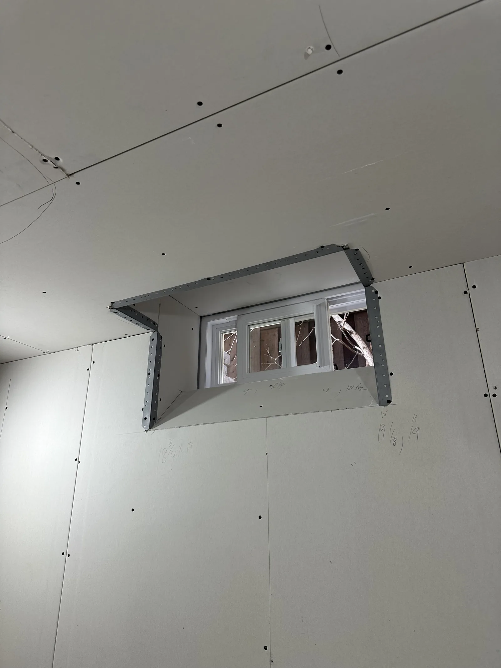 Drywalled window return in the basement build