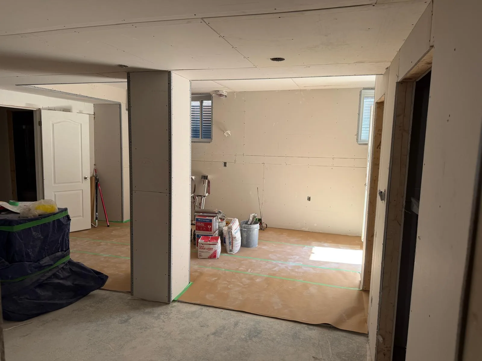 Subfloor going down in the painted basement