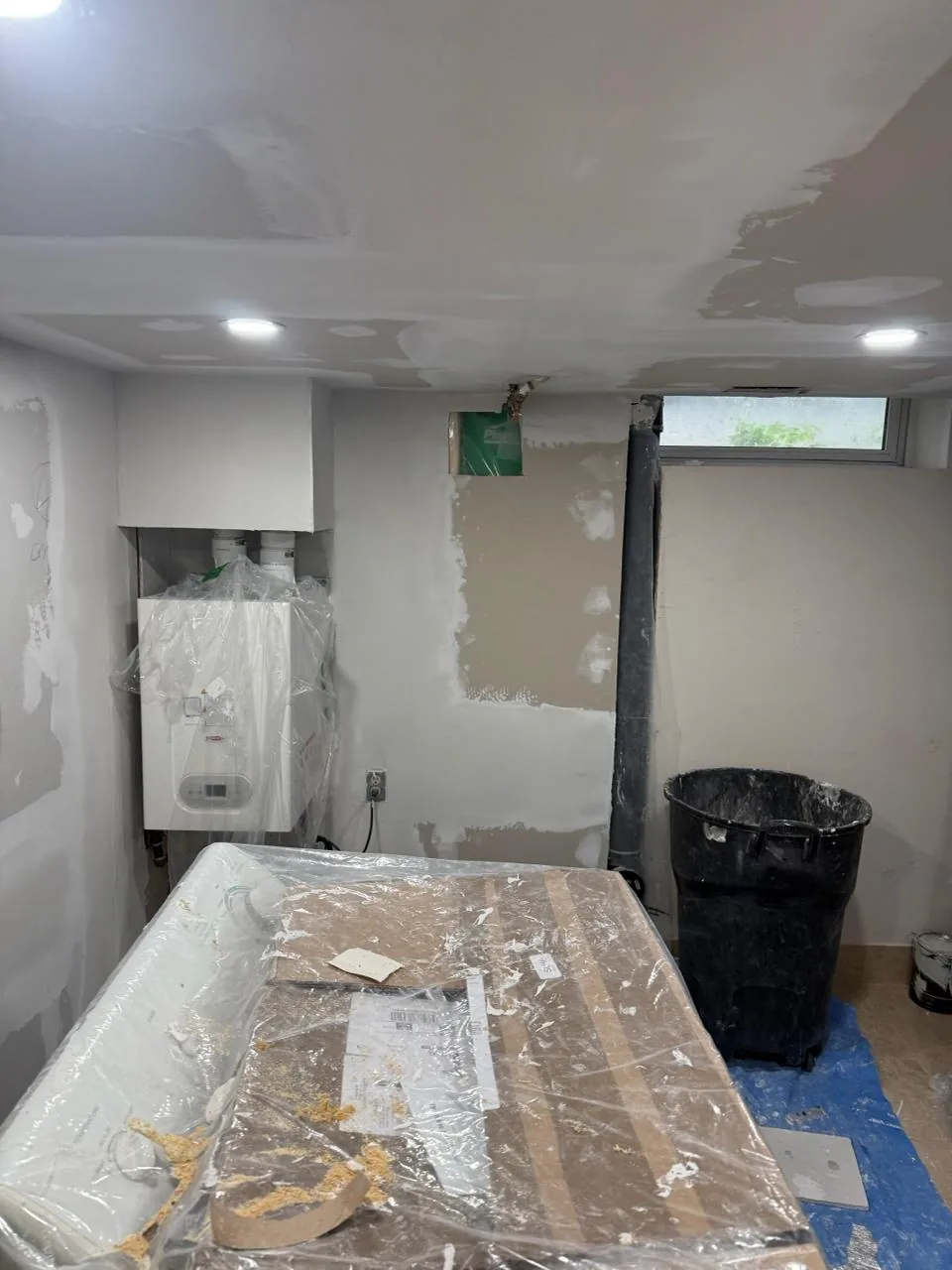 Pot lights in and walls painted as the basement is finished