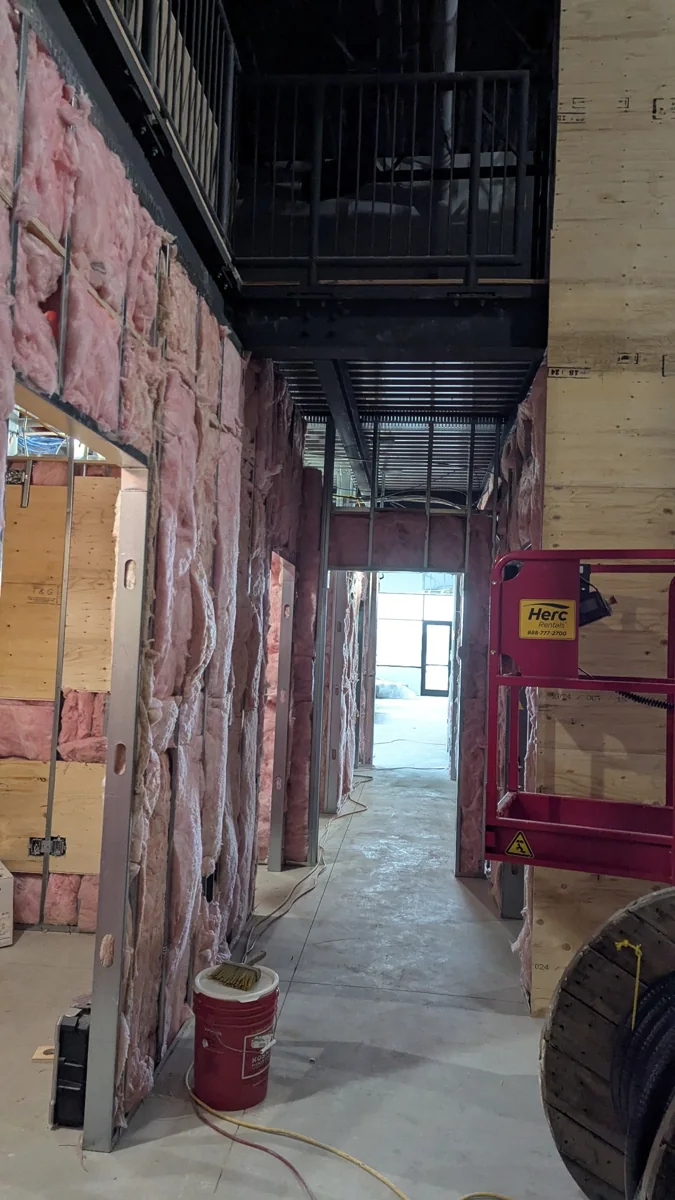 Framed and insulated walls partway through the build