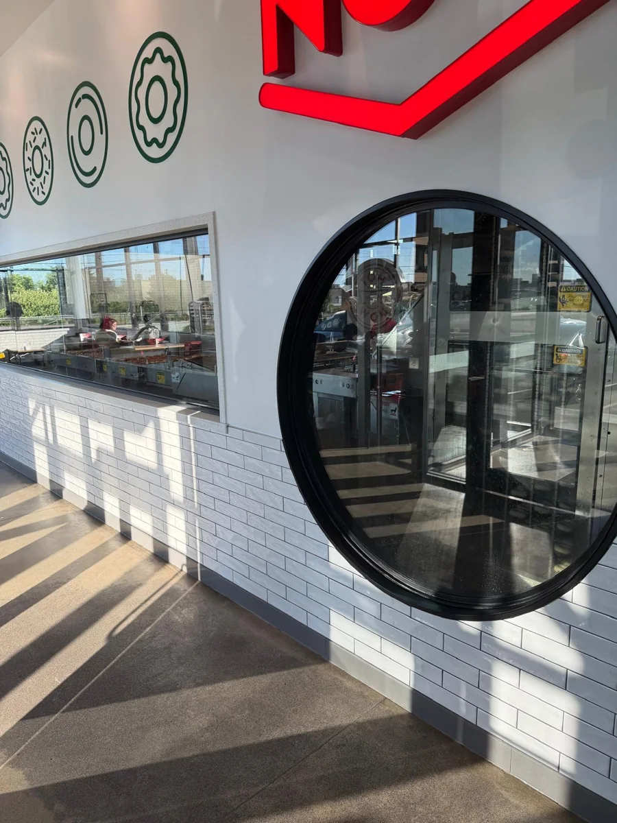 Krispy Kreme entrance with a circular glass doorway