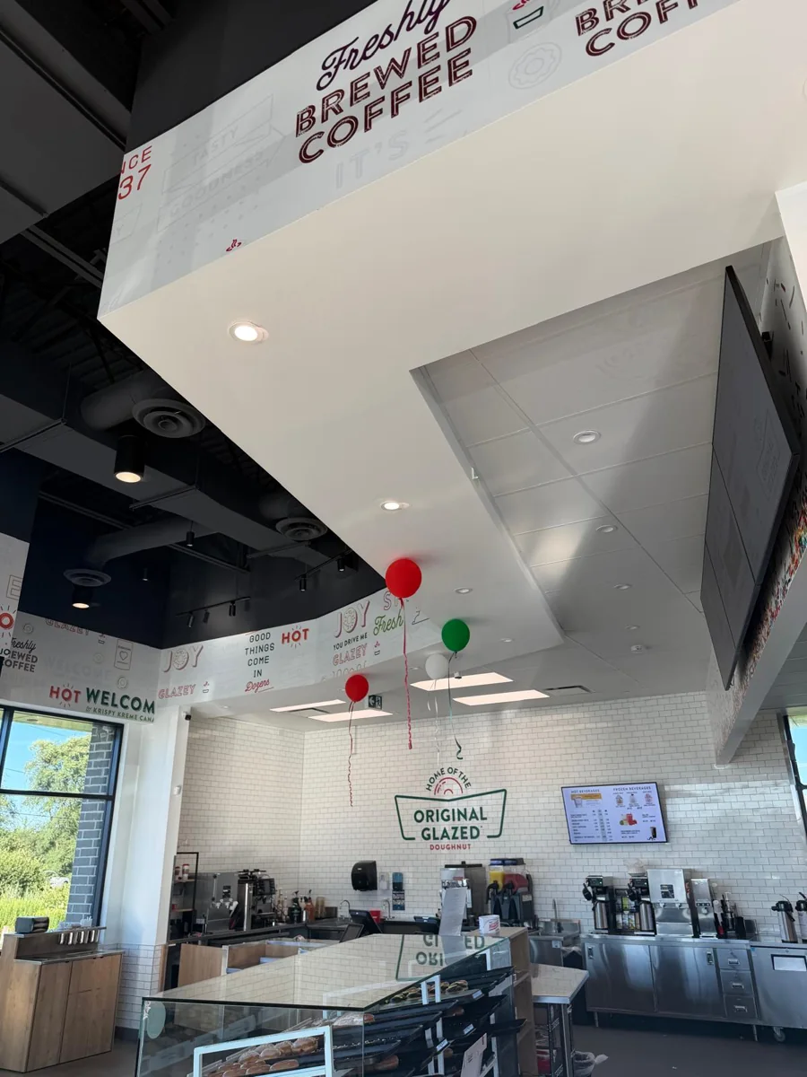 Finished Krispy Kreme interior with the service counter and signage