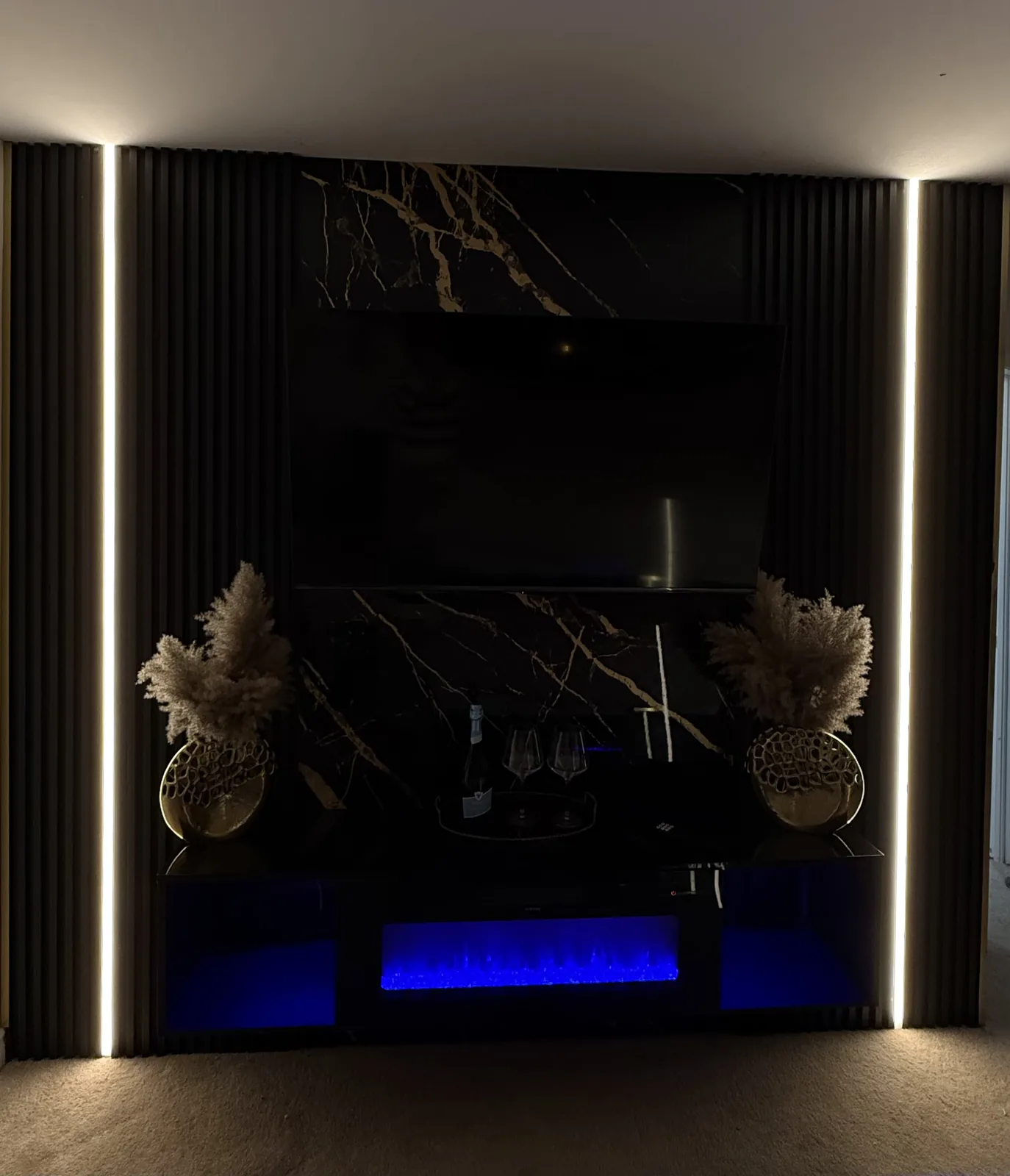 Backlit stone feature wall, warmly lit